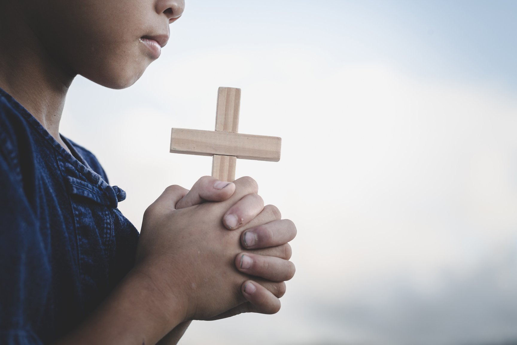 children worship God by holding christian Cross  , christian concept.